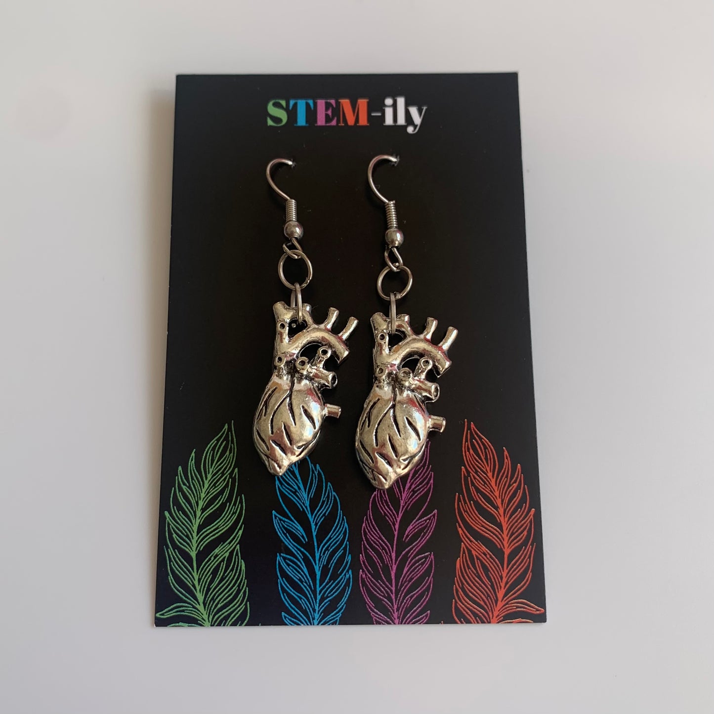 Silver anatomical heart biology dangle earrings on hypoallergenic surgical steel hooks