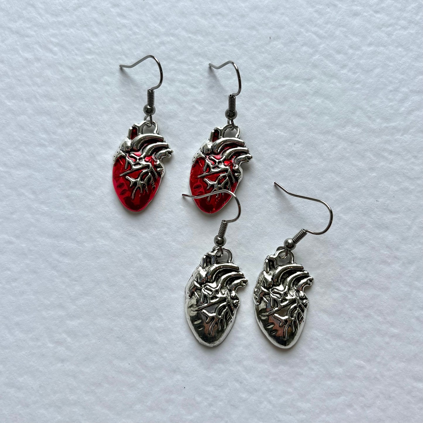 Silver or red anatomical heart dangle earrings