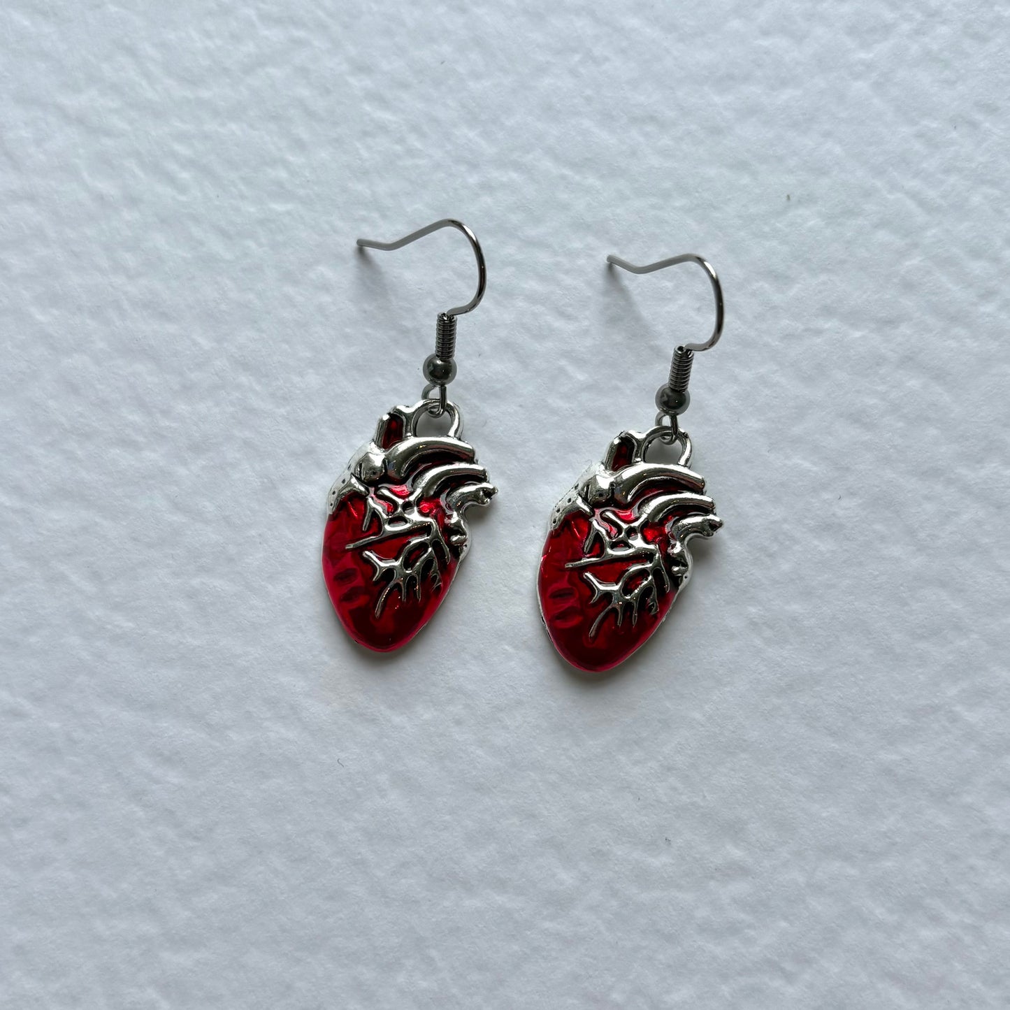 Silver or red anatomical heart dangle earrings