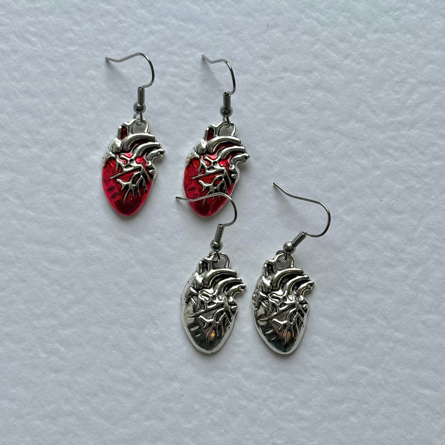 Silver or red anatomical heart dangle earrings