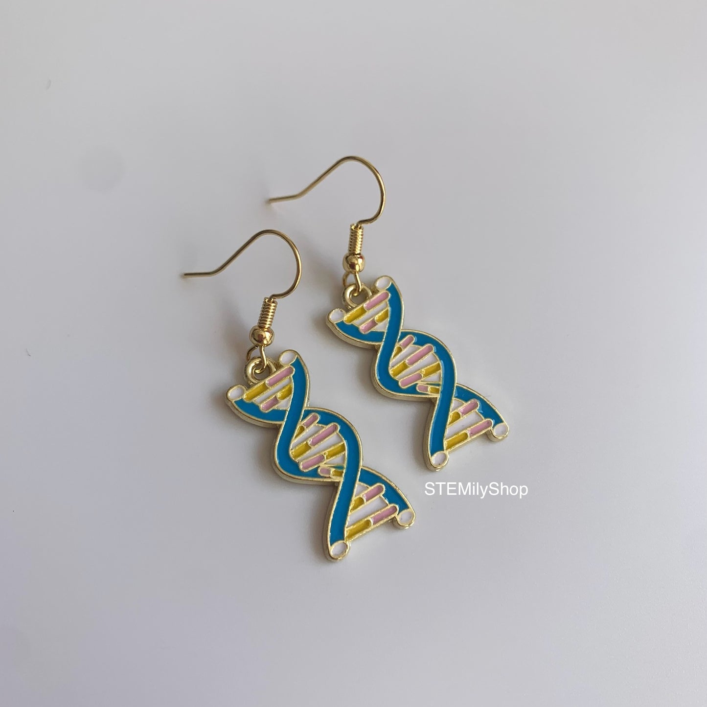 Gold science DNA blue dangle earrings